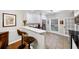 Well-lit kitchen with white cabinetry, stainless steel appliances, and a breakfast bar at 5105 Chemin De Vie, Atlanta, GA 30342