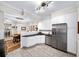 Contemporary kitchen features white cabinets, stainless steel appliances and adjacent breakfast nook at 5105 Chemin De Vie, Atlanta, GA 30342