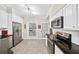 Clean kitchen featuring stainless appliances, and white cabinetry, for a modern design at 5105 Chemin De Vie, Atlanta, GA 30342