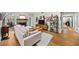 Bright living room with hardwood floors, fireplace, and comfortable sofa at 5105 Chemin De Vie, Atlanta, GA 30342
