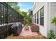 Charming outdoor patio area with a grill, seating, and string lights at 5105 Chemin De Vie, Atlanta, GA 30342