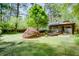 Expansive backyard featuring a deck, mature trees, and a well-maintained lawn, offering a serene outdoor space at 2469 Hunting Valley Dr, Decatur, GA 30033