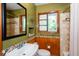 Bathroom with an earth-tone color scheme featuring a decorative tile accent and matching wood trim at 2469 Hunting Valley Dr, Decatur, GA 30033