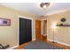 Bedroom with hardwood floors, double door closet, an accent rug, and a neutral color scheme at 2469 Hunting Valley Dr, Decatur, GA 30033
