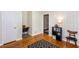 The bedroom has hardwood floors, wainscoting, and a built-in niche with a small desk and chair at 2469 Hunting Valley Dr, Decatur, GA 30033