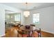 Bright dining room with hardwood floors, a chandelier, and lots of windows at 2469 Hunting Valley Dr, Decatur, GA 30033