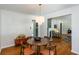 Stylish dining room featuring hardwood floors, a chandelier, and a view into the living room at 2469 Hunting Valley Dr, Decatur, GA 30033