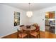 Elegant dining room featuring a chandelier, hardwood floors, and lots of natural light at 2469 Hunting Valley Dr, Decatur, GA 30033