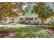 Charming one-story home featuring a well-manicured lawn and a covered carport at 2469 Hunting Valley Dr, Decatur, GA 30033