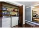 Laundry room with washer, dryer, and door open to adjacent kitchen area at 2469 Hunting Valley Dr, Decatur, GA 30033