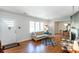 Bright living room featuring hardwood floors, large windows, and a view into the dining area at 2469 Hunting Valley Dr, Decatur, GA 30033