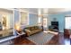 Charming living room with sleek flooring, blue walls, modern decor, and ample natural light at 2469 Hunting Valley Dr, Decatur, GA 30033
