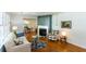 Cozy living room with fireplace, hardwood floors, and an open view into the dining area at 2469 Hunting Valley Dr, Decatur, GA 30033