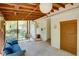 Bright screened porch with wooden ceiling beams, comfortable seating, and access to the outdoors at 2469 Hunting Valley Dr, Decatur, GA 30033