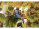 A stunning bird's-eye view highlighting the estate's pool, private surroundings and meticulously maintained grounds at 2636 Harvest Se Dr, Conyers, GA 30013