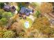Breathtaking aerial view of the property, featuring a sparkling pool and lush fall landscaping at 2636 Harvest Se Dr, Conyers, GA 30013