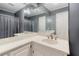 Bathroom with an extra large mirror and a neutral colored sink and vanity at 2636 Harvest Se Dr, Conyers, GA 30013
