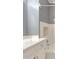 Close up of a bathroom with white vanity and tub at 2636 Harvest Se Dr, Conyers, GA 30013