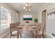 Elegant dining room featuring a large window and seating for eight at 2636 Harvest Se Dr, Conyers, GA 30013
