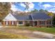 Beautiful brick home with black shutters and a well-manicured lawn at 2636 Harvest Se Dr, Conyers, GA 30013
