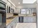 Spacious kitchen with granite countertops and stainless steel appliances at 2636 Harvest Se Dr, Conyers, GA 30013
