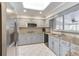 Bright kitchen with stainless steel appliances, granite counters, and skylight at 2636 Harvest Se Dr, Conyers, GA 30013