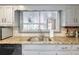 Kitchen sink area featuring granite countertops and bright natural light at 2636 Harvest Se Dr, Conyers, GA 30013