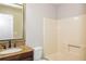 Bathroom with shower/tub, wooden vanity, granite countertop, designer mirror, and neutral paint at 3790 Willow Ridge Rd, Douglasville, GA 30135