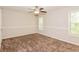 Comfortable bedroom featuring neutral paint, plush carpet, and a ceiling fan with lighting at 3790 Willow Ridge Rd, Douglasville, GA 30135
