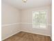 Bright bedroom featuring neutral walls, plush carpet, and a window with natural light at 3790 Willow Ridge Rd, Douglasville, GA 30135