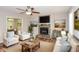 Bright living room with a stone fireplace, comfortable seating, and stylish decor at 3790 Willow Ridge Rd, Douglasville, GA 30135