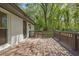 Wooden deck off the back of home with white painted brick and brown wooden railings at 4973 Gunners Ne Pass, Roswell, GA 30075