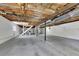 Unfinished basement with exposed ceiling, painted walls, and large open space at 4973 Gunners Ne Pass, Roswell, GA 30075