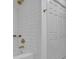 Bathroom with white subway tile, gold hardware, and shower with glass shelving at 4973 Gunners Ne Pass, Roswell, GA 30075