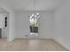 Contemporary dining room with hardwood floors and a modern chandelier at 4973 Gunners Ne Pass, Roswell, GA 30075