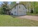 Charming two-story home with a white brick exterior, double garage, and well-manicured lawn at 4973 Gunners Ne Pass, Roswell, GA 30075