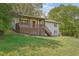 A charming home boasts a lovely covered porch with an inviting red front door at 4973 Gunners Ne Pass, Roswell, GA 30075