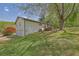 Exterior of the house with a two-car garage, large backyard, and wooden deck at 4973 Gunners Ne Pass, Roswell, GA 30075