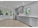 Updated kitchen features gray cabinets, stainless appliances, subway tile backsplash and breakfast nook at 4973 Gunners Ne Pass, Roswell, GA 30075