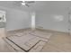 Bright and airy living room with light colored hardwood floors and a contemporary rug at 4973 Gunners Ne Pass, Roswell, GA 30075