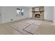 Spacious living room featuring a stone fireplace and plenty of natural light at 4973 Gunners Ne Pass, Roswell, GA 30075