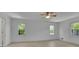 Large main bedroom with hardwood floors, a ceiling fan, and large windows at 4973 Gunners Ne Pass, Roswell, GA 30075