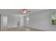 Bright main bedroom featuring hardwood floors, a ceiling fan, and natural light at 4973 Gunners Ne Pass, Roswell, GA 30075