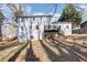 Backyard view of a white two-story home with a small deck at 5465 N Fork Sw Dr, Lilburn, GA 30047