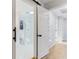 Bathroom with sliding barn door and walk-in shower with glass doors at 5465 N Fork Sw Dr, Lilburn, GA 30047