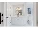 Bathroom featuring a new vanity, modern light fixture, and stylish white cabinets at 5465 N Fork Sw Dr, Lilburn, GA 30047