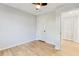 This bedroom includes hardwood floors, ceiling fan, and closet at 5465 N Fork Sw Dr, Lilburn, GA 30047
