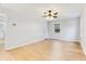 Bedroom featuring light wood flooring and a modern ceiling fan with views of the outdoors at 5465 N Fork Sw Dr, Lilburn, GA 30047