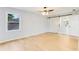 Bedroom featuring sliding barn door and light wood flooring with windows to the outside at 5465 N Fork Sw Dr, Lilburn, GA 30047