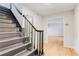 View of the entryway featuring hardwood floors, staircase, and access to the living room at 5465 N Fork Sw Dr, Lilburn, GA 30047